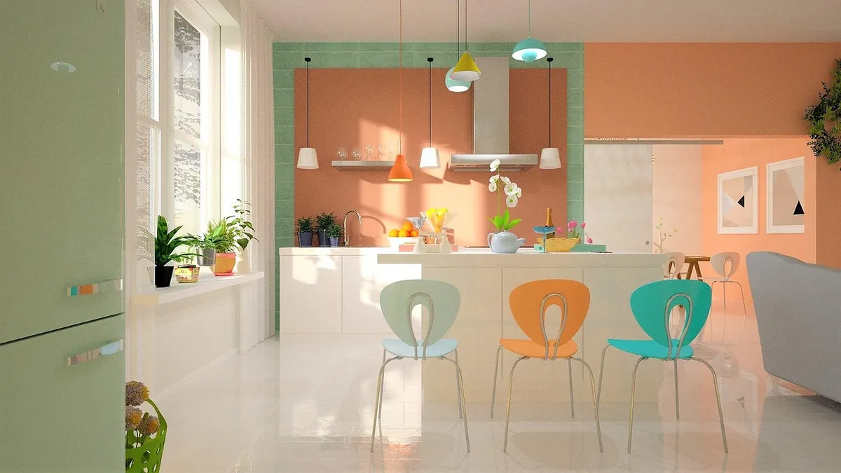 Cozinha clara com geladeira verde e cadeiras coloridas